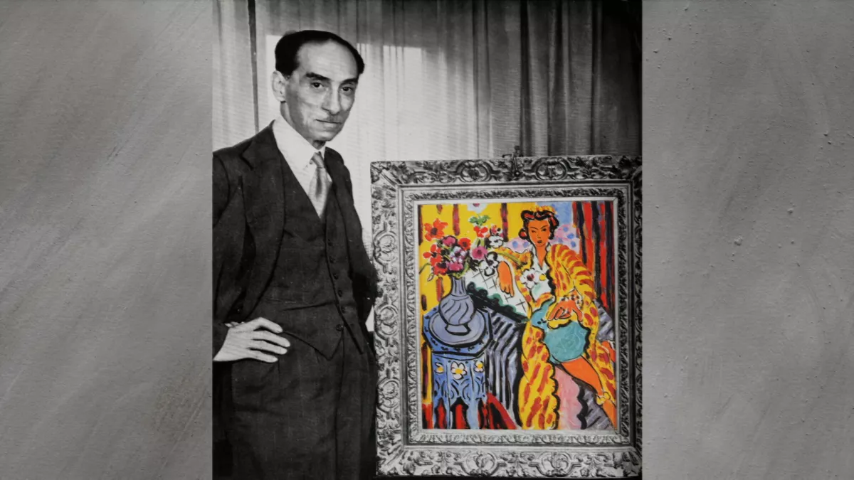 Paul Rosenberg à côté de l'« Odalisque à la robe persane jaune, anémones » d'Henri Matisse. © Image et Compagnie 21, RUE DE LA BOETIE