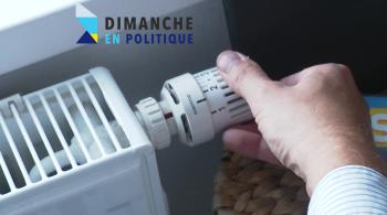 Crise énergétique - une main réduit la température du chauffage électrique